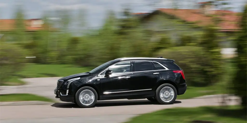 Тест-драйв Cadillac XT5 против Jaguar F-Pace